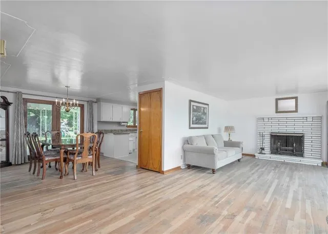a view of a livingroom with furniture window and wooden floor