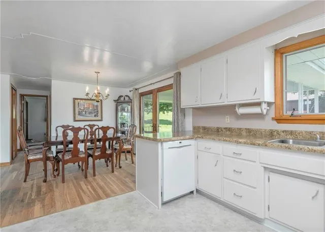 a view of a kitchen and dining area