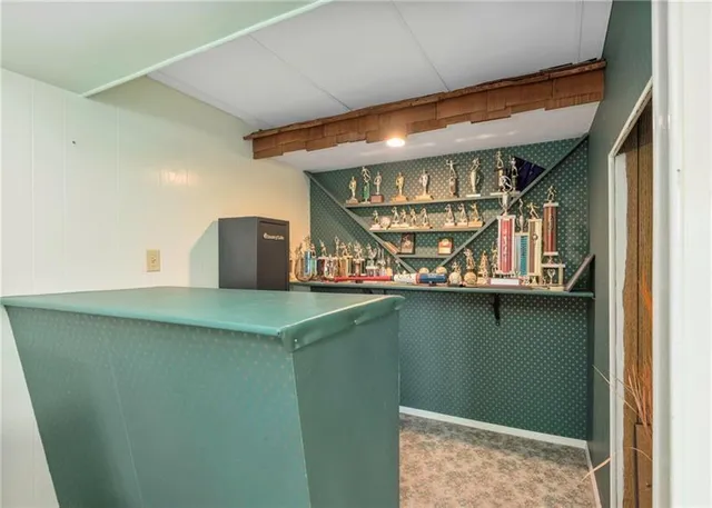 a room with lots of wooden cabinets