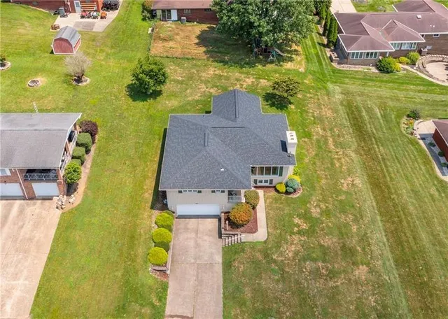 an aerial view of residential houses with swimming pool
