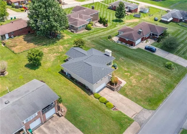 an aerial view of a house with a garden