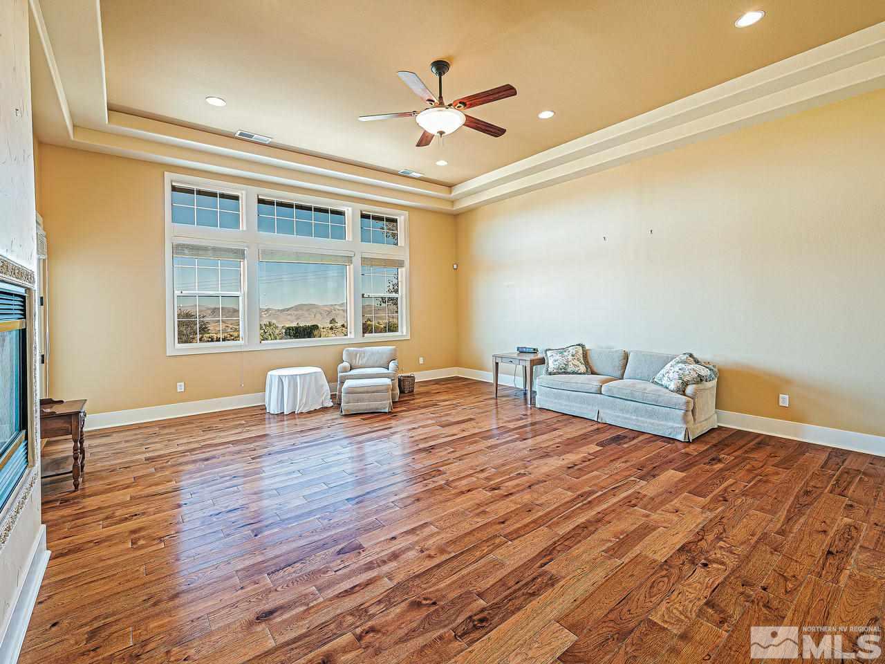 3644 Silver Vista Drive Reno, NV 89511 - Photo 14 of 40 a living room with couch and wooden floor