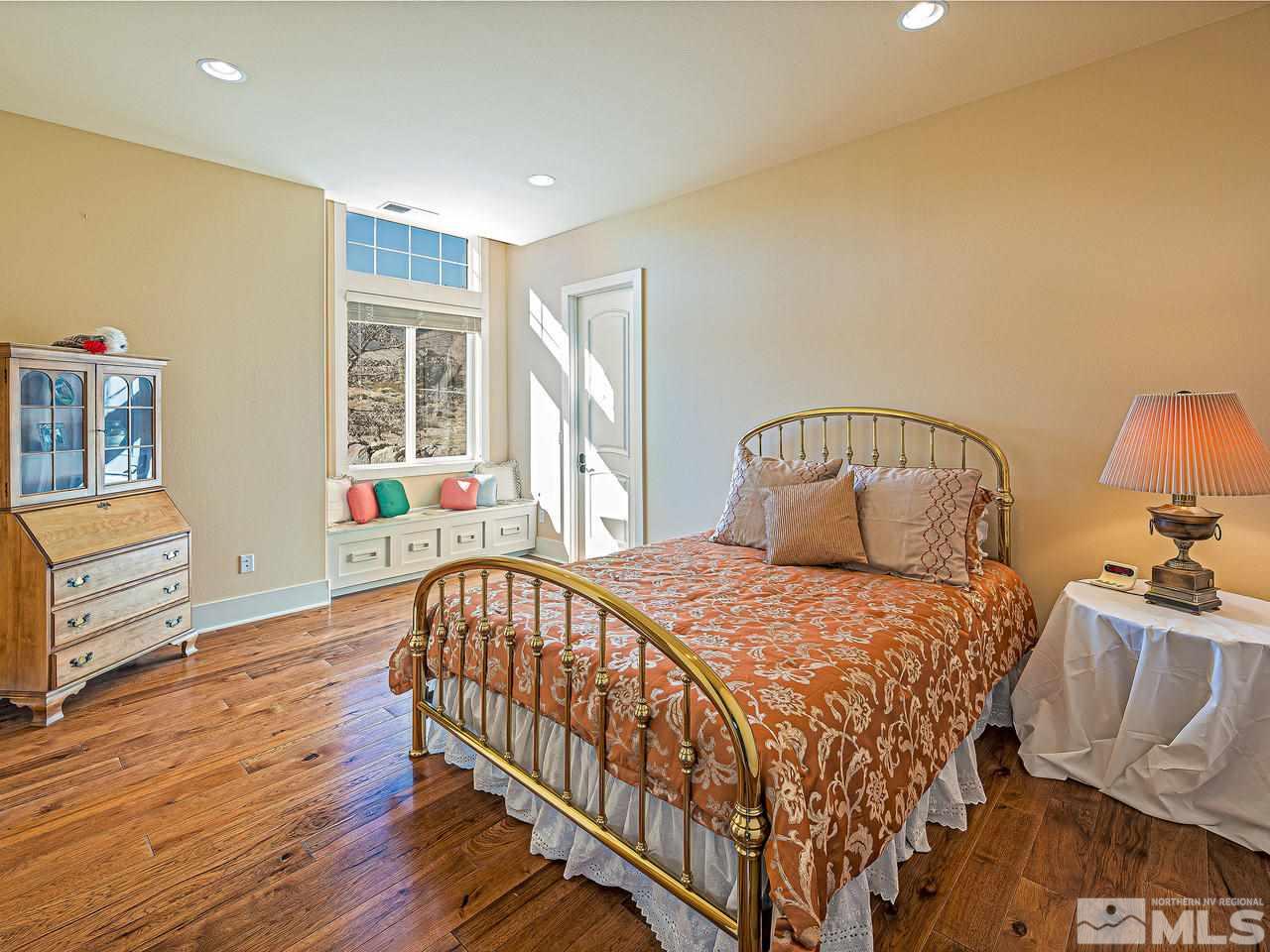 3644 Silver Vista Drive Reno, NV 89511 - Photo 17 of 40 a bedroom with a bed next to a window with outer view