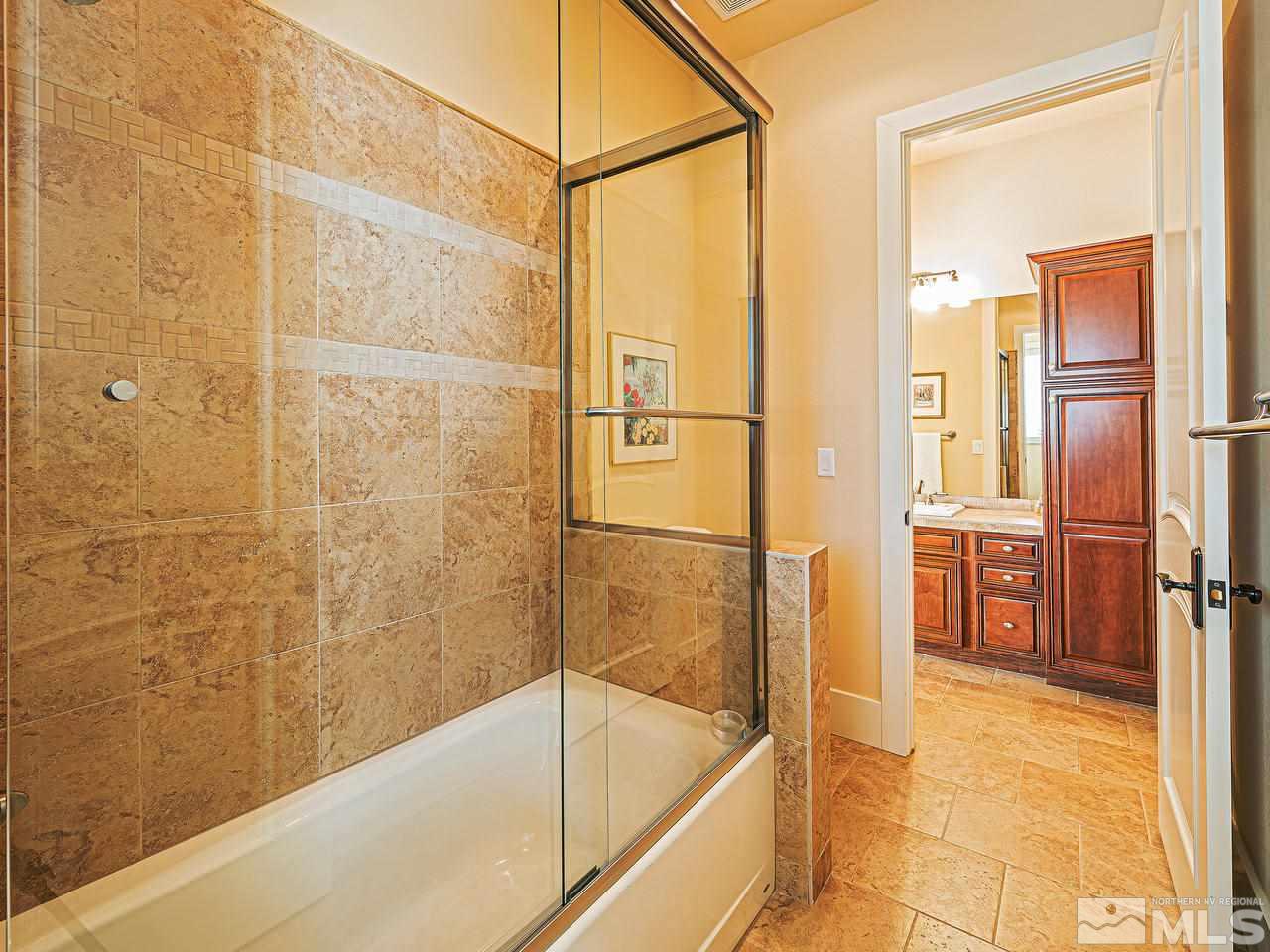 3644 Silver Vista Drive Reno, NV 89511 - Photo 18 of 40 a bathroom with a bathtub and a shower