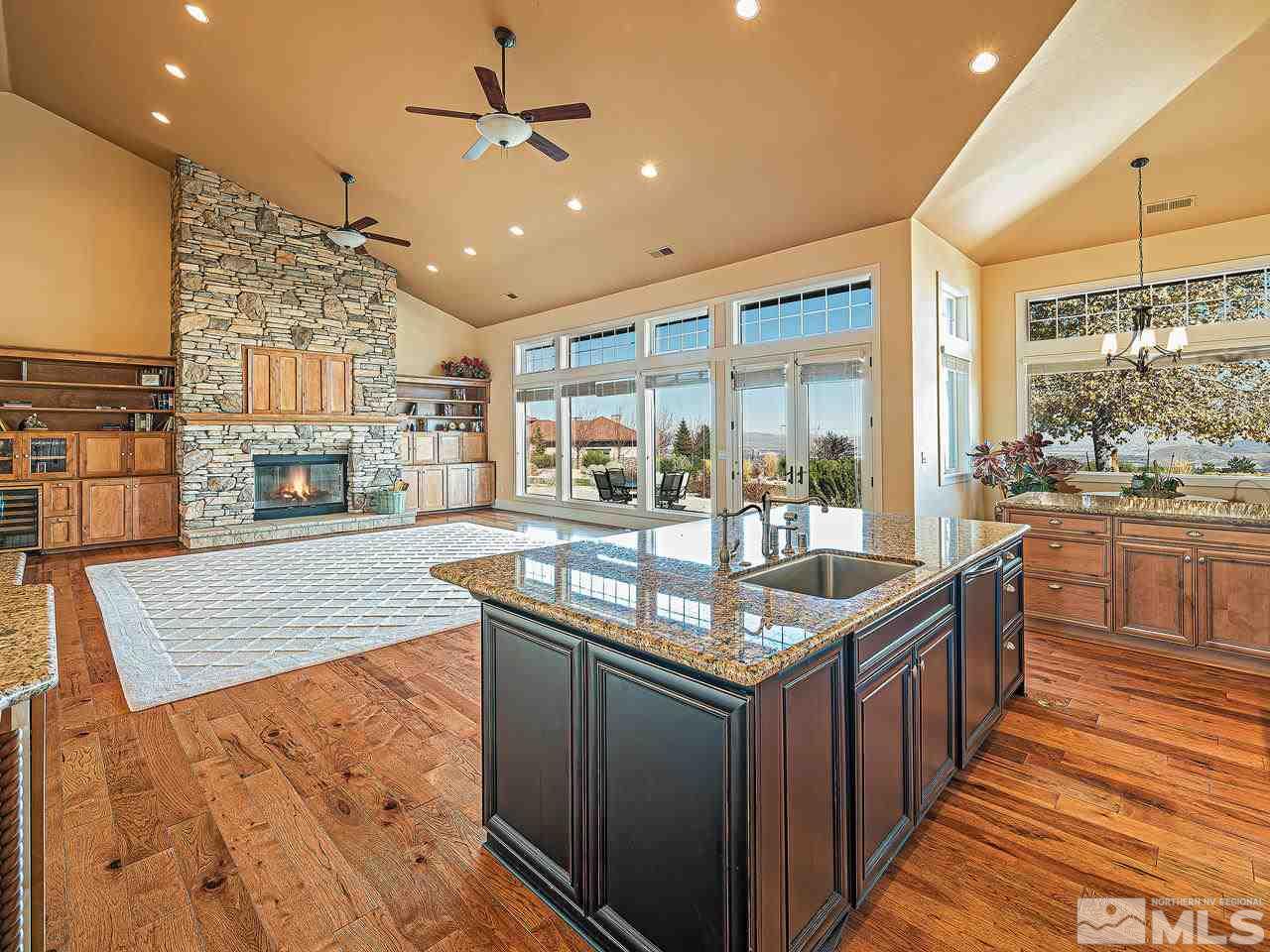 3644 Silver Vista Drive Reno, NV 89511 - Photo 10 of 40 a kitchen with granite countertop sink stove and cabinets