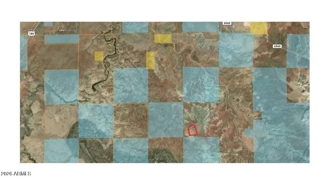 a aerial view of a house with a yard