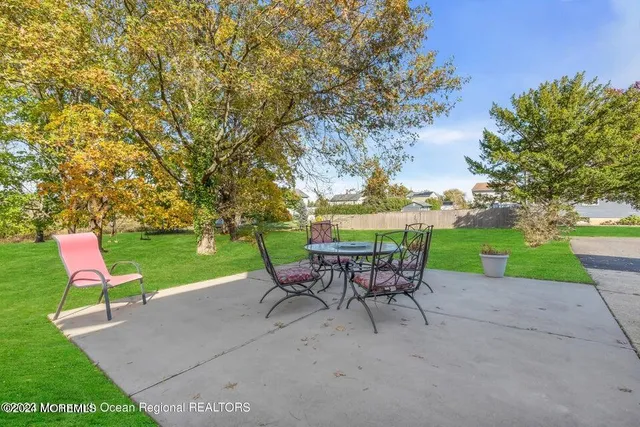 a view of a chairs and table in the garden