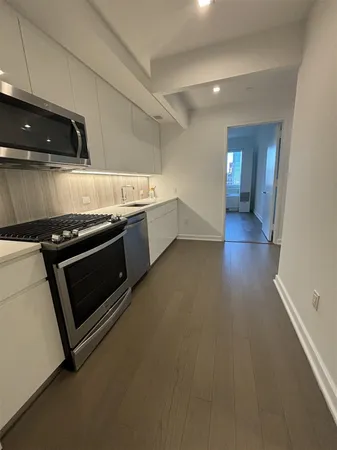 a kitchen with a stove and a microwave