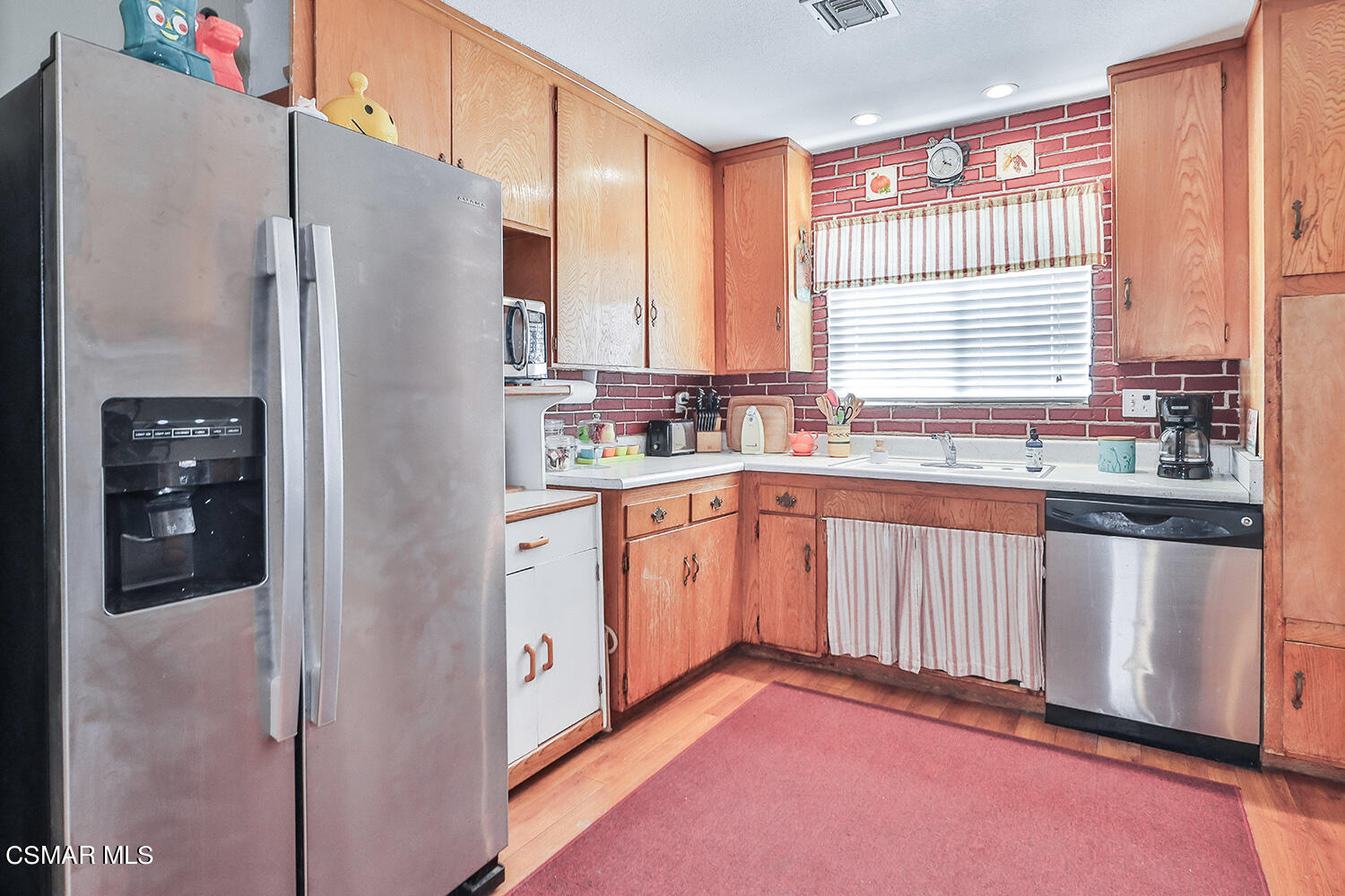 2248 Cutler Street Simi Valley, CA 93065 - Photo 16 of 41 a kitchen with stainless steel appliances a refrigerator sink and cabinets
