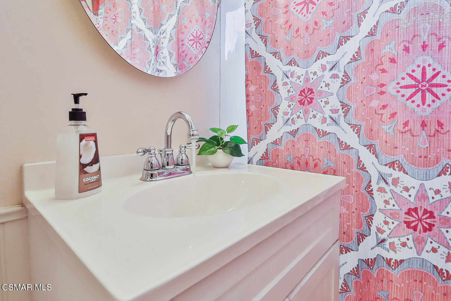 2248 Cutler Street Simi Valley, CA 93065 - Photo 27 of 41 a close view of a sink a faucet a stove and a potted plant
