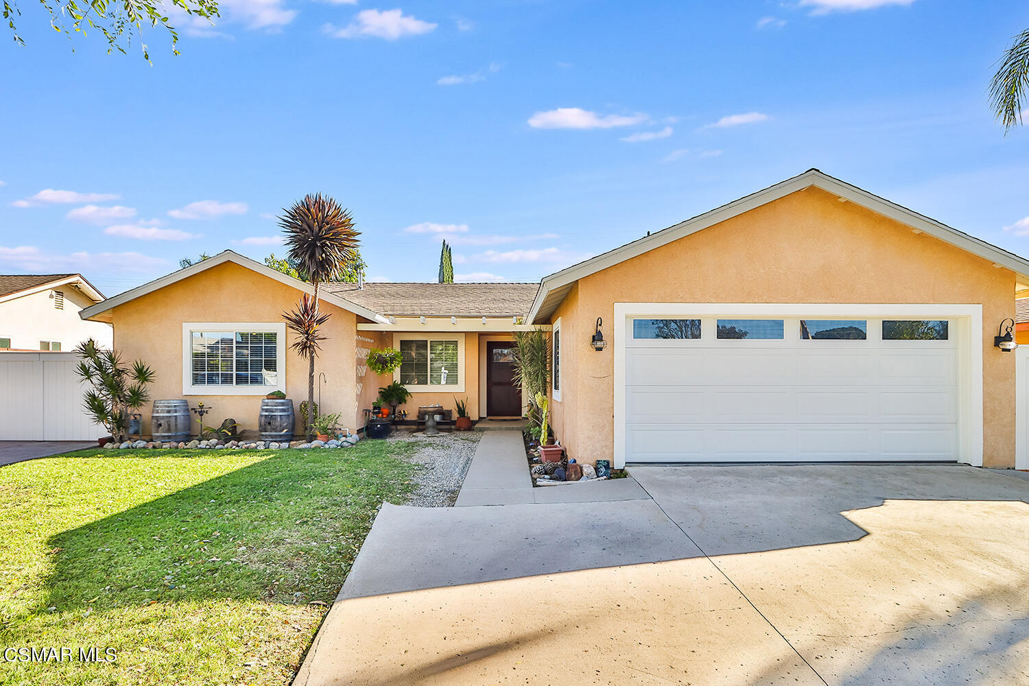 2248 Cutler Street Simi Valley, CA 93065 - Photo 3 of 41 a front view of a house with a yard and garage