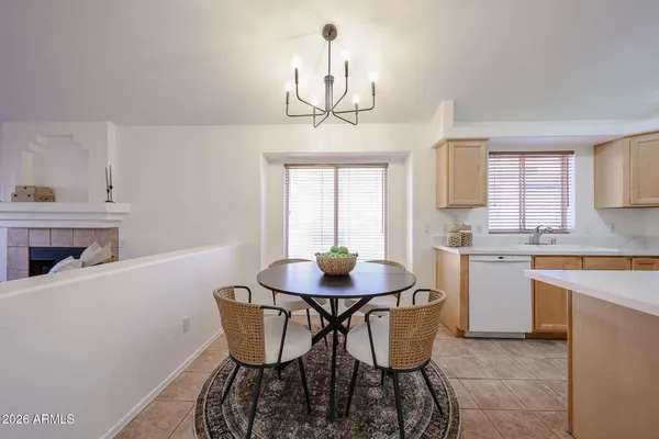 a dining room with furniture and window