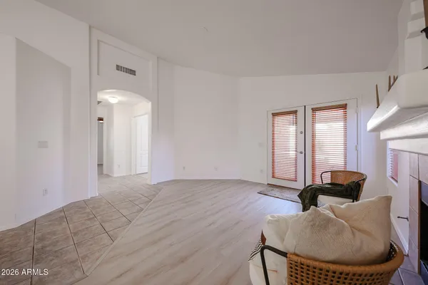 a view of a livingroom with furniture and a fireplace