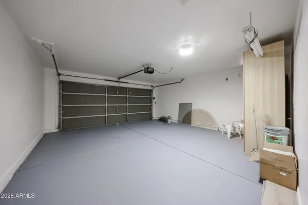 a view of an empty room and a window