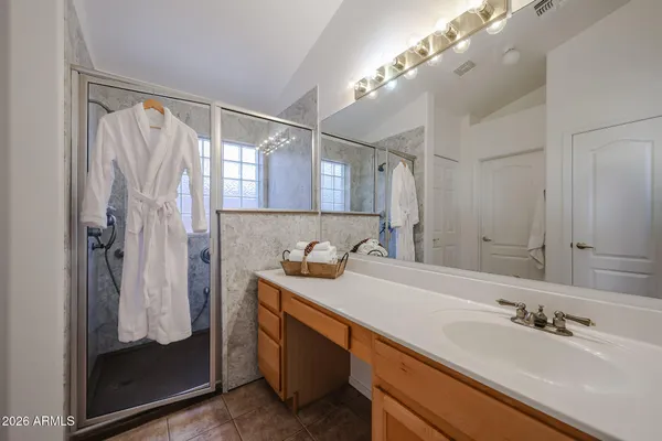 a bathroom with a bath tub and shower