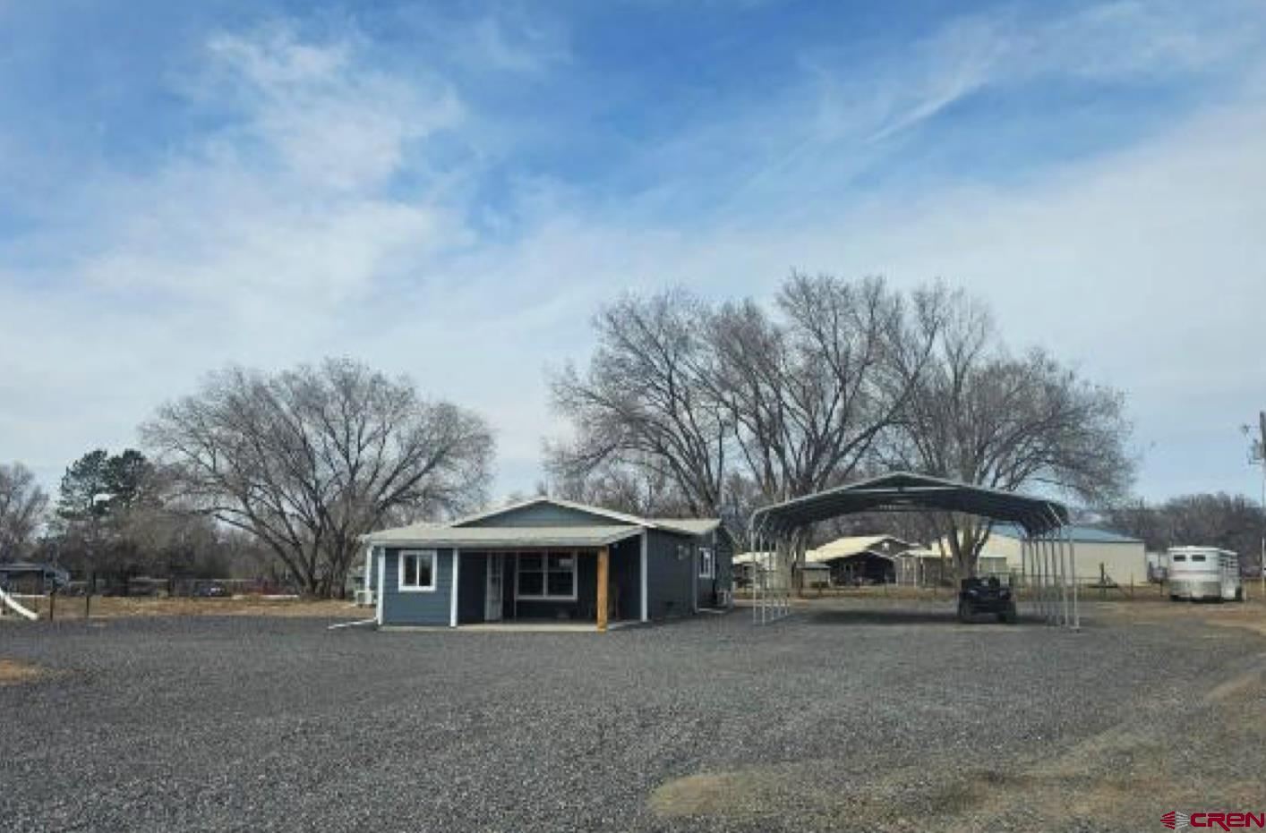 20167 Fairview Road Austin, CO 81410 - Photo 3 of 4 a front view of a house with a yard and garage