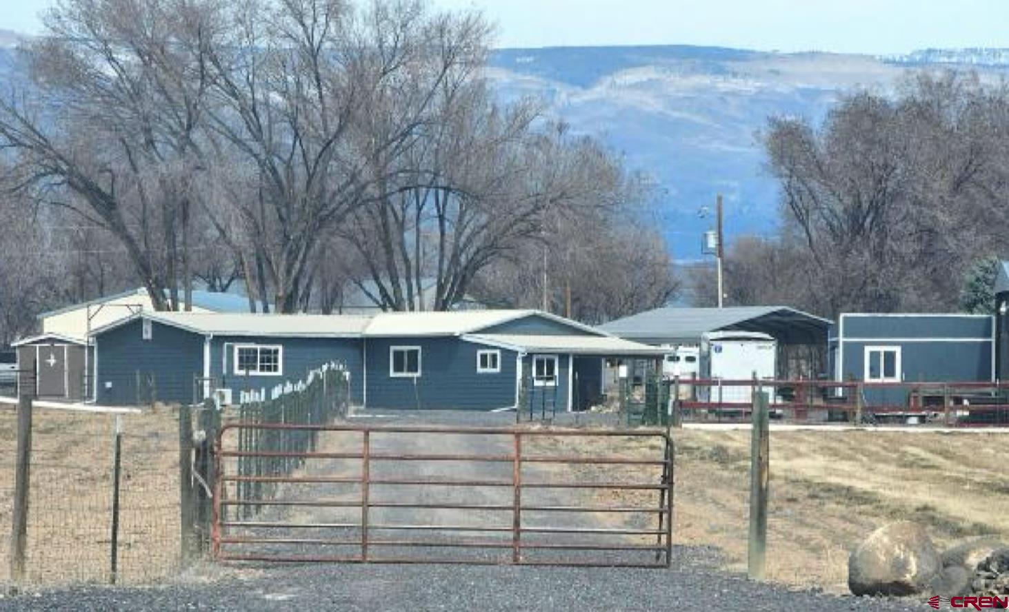 20167 Fairview Road Austin, CO 81410 - Photo 4 of 4 a front view of a residential apartment building with a yard