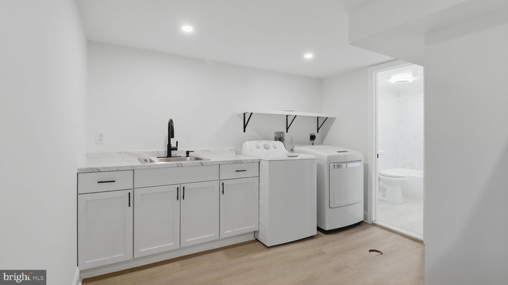 5633 Jamestown Road Hyattsville, MD 20782 - Photo 34 of 47 Modern laundry space with sleek design.