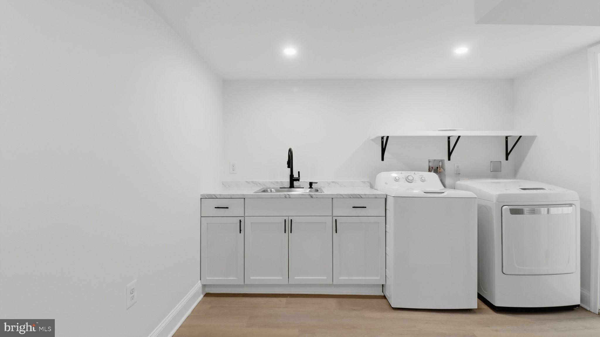 5633 Jamestown Road Hyattsville, MD 20782 - Photo 35 of 47 Sleek laundry space with modern finishes.