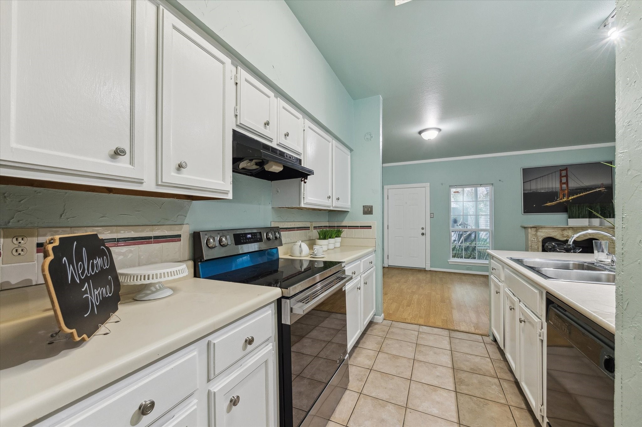 7326 Regency Square Court, Unit 7326 Houston, TX 77036 - Photo 1 of 17 a kitchen with a sink and cabinets