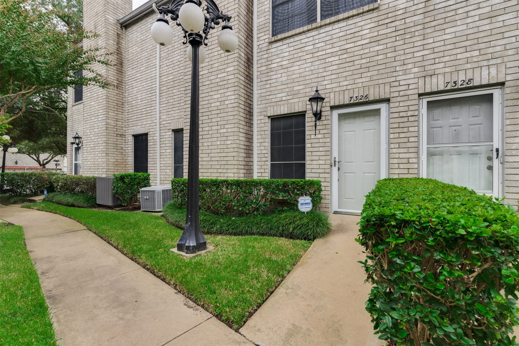 7326 Regency Square Court, Unit 7326 Houston, TX 77036 - Photo 12 of 17 a front view of a house with garden