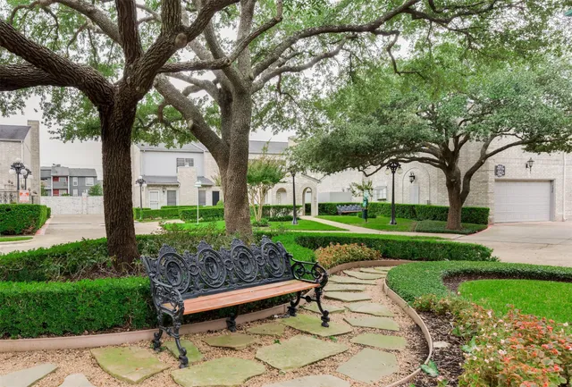a view of a bench in a garden
