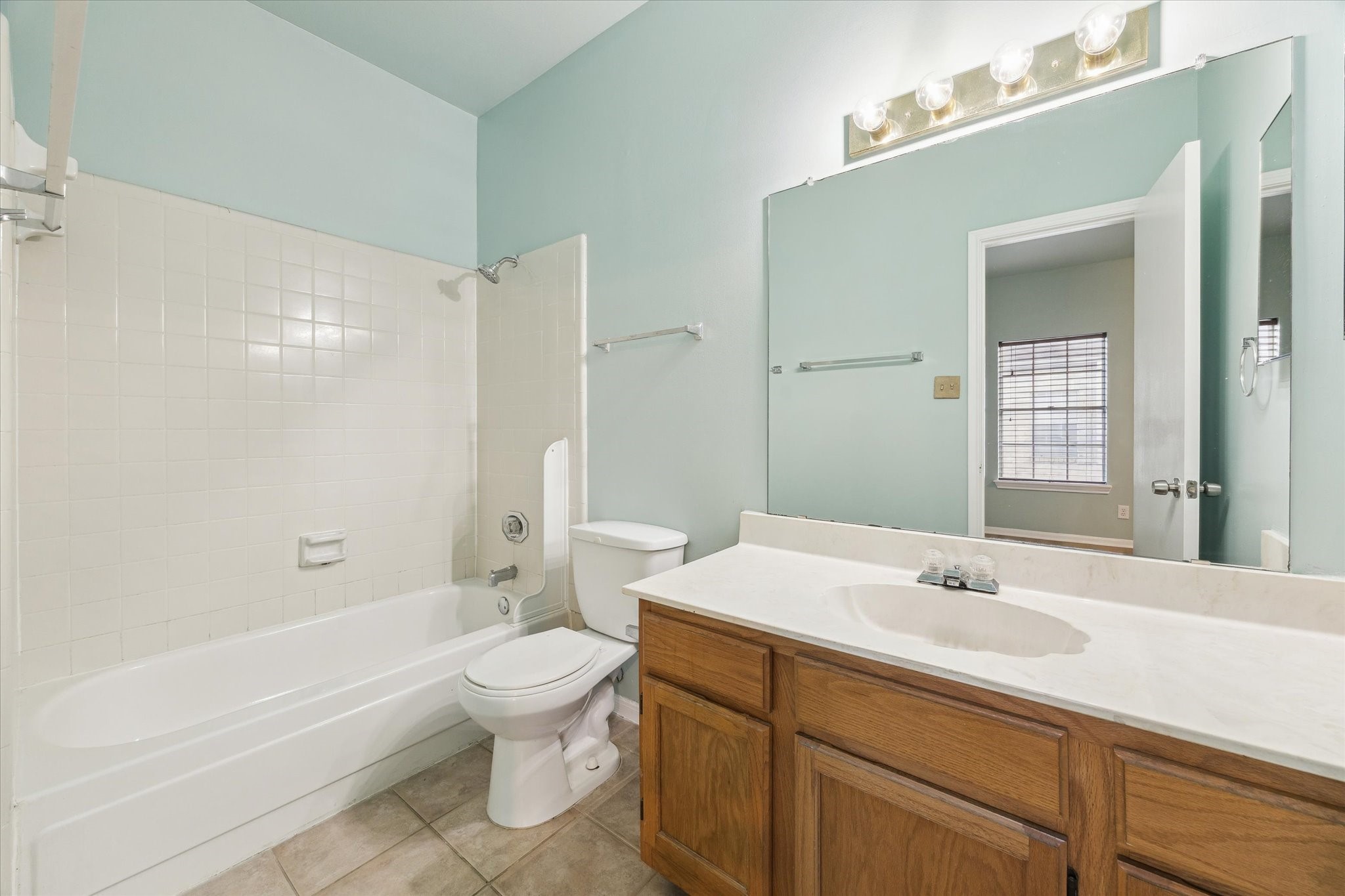 7326 Regency Square Court, Unit 7326 Houston, TX 77036 - Photo 9 of 17 a bathroom with a sink a toilet and shower