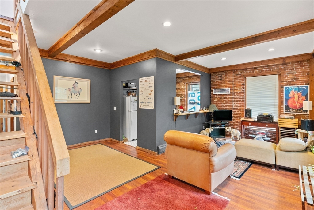 100-102 Main Street Gloucester, MA 01930 - Photo 28 of 40 a living room with furniture and a table
