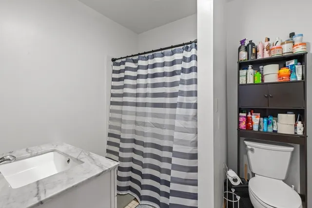 a utility room with multiple dryer and washer