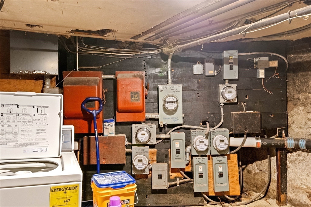 100-102 Main Street Gloucester, MA 01930 - Photo 37 of 40 a utility room with multiple dryer and washer