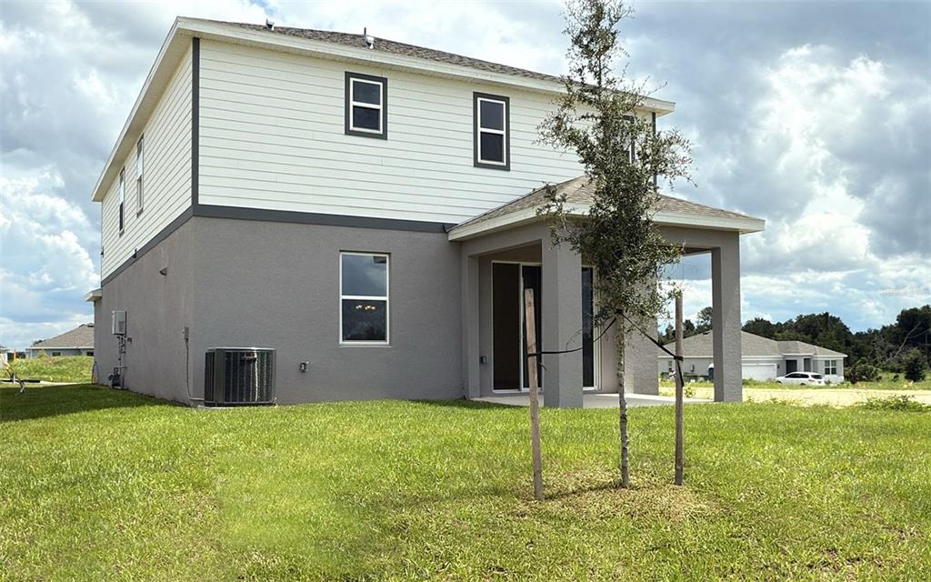 6867 Spanish Imperial Street Howey-in-the-Hills, FL 34737 - Photo 17 of 20 a house that has a backyard