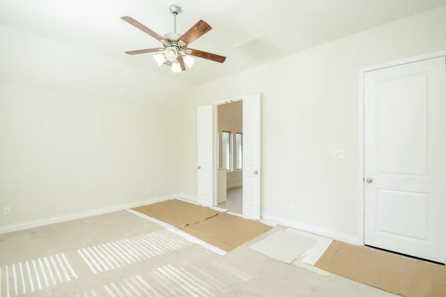a spacious bathroom with a bathtub and a shower