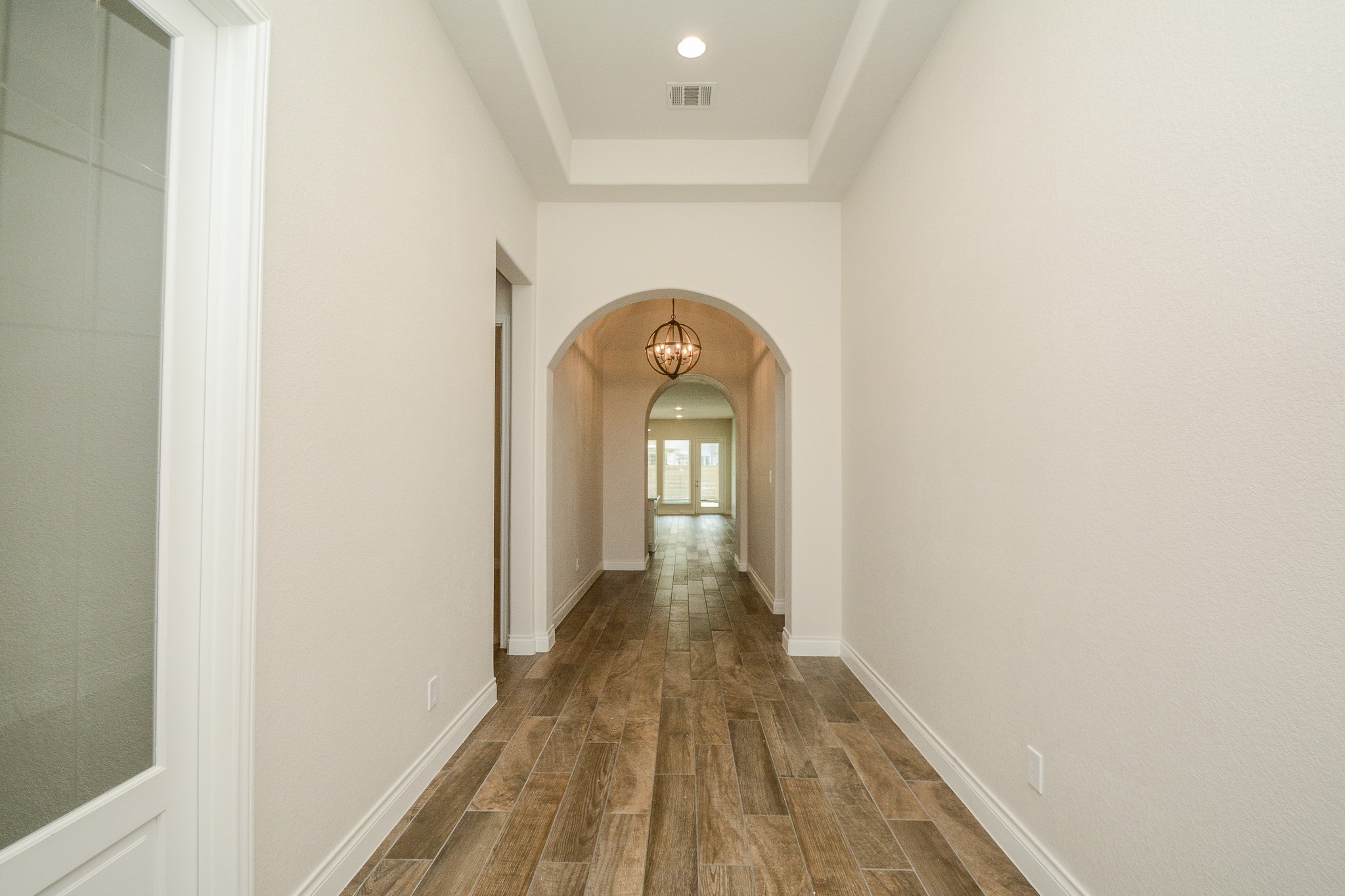 28127 Knight Peak Drive Spring, TX 77386 - Photo 2 of 42 a view of a hallway with wooden floor