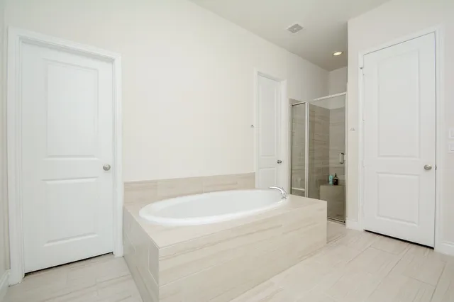 a white bath tub sitting in a bathroom