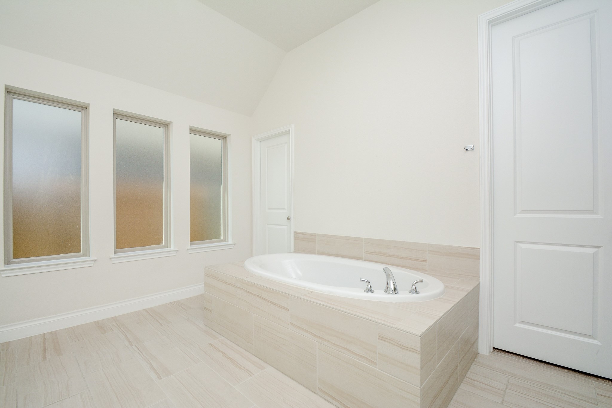28127 Knight Peak Drive Spring, TX 77386 - Photo 22 of 42 a white bath tub sitting in a bathroom