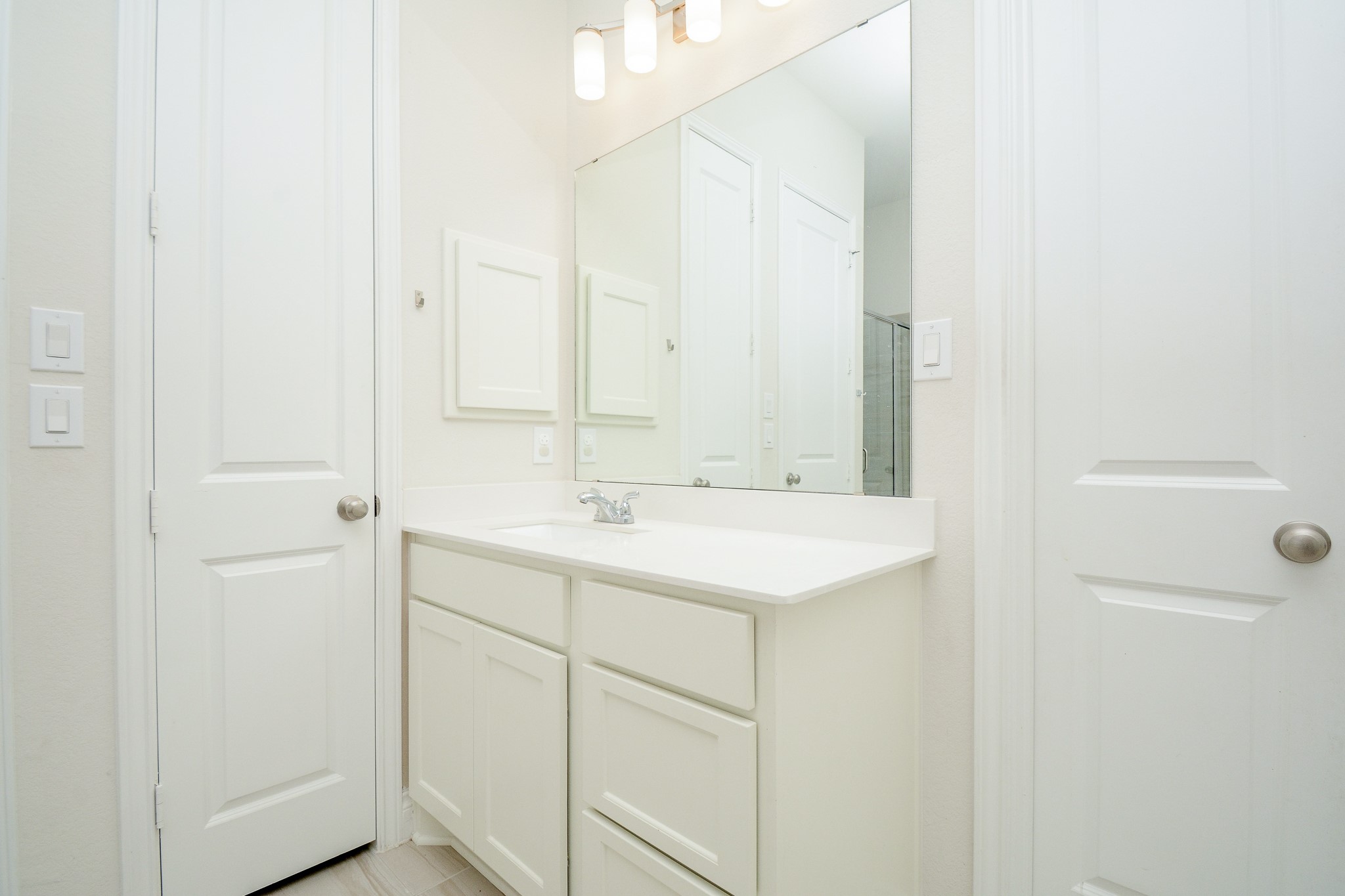 28127 Knight Peak Drive Spring, TX 77386 - Photo 24 of 42 a bathroom with a sink and a mirror