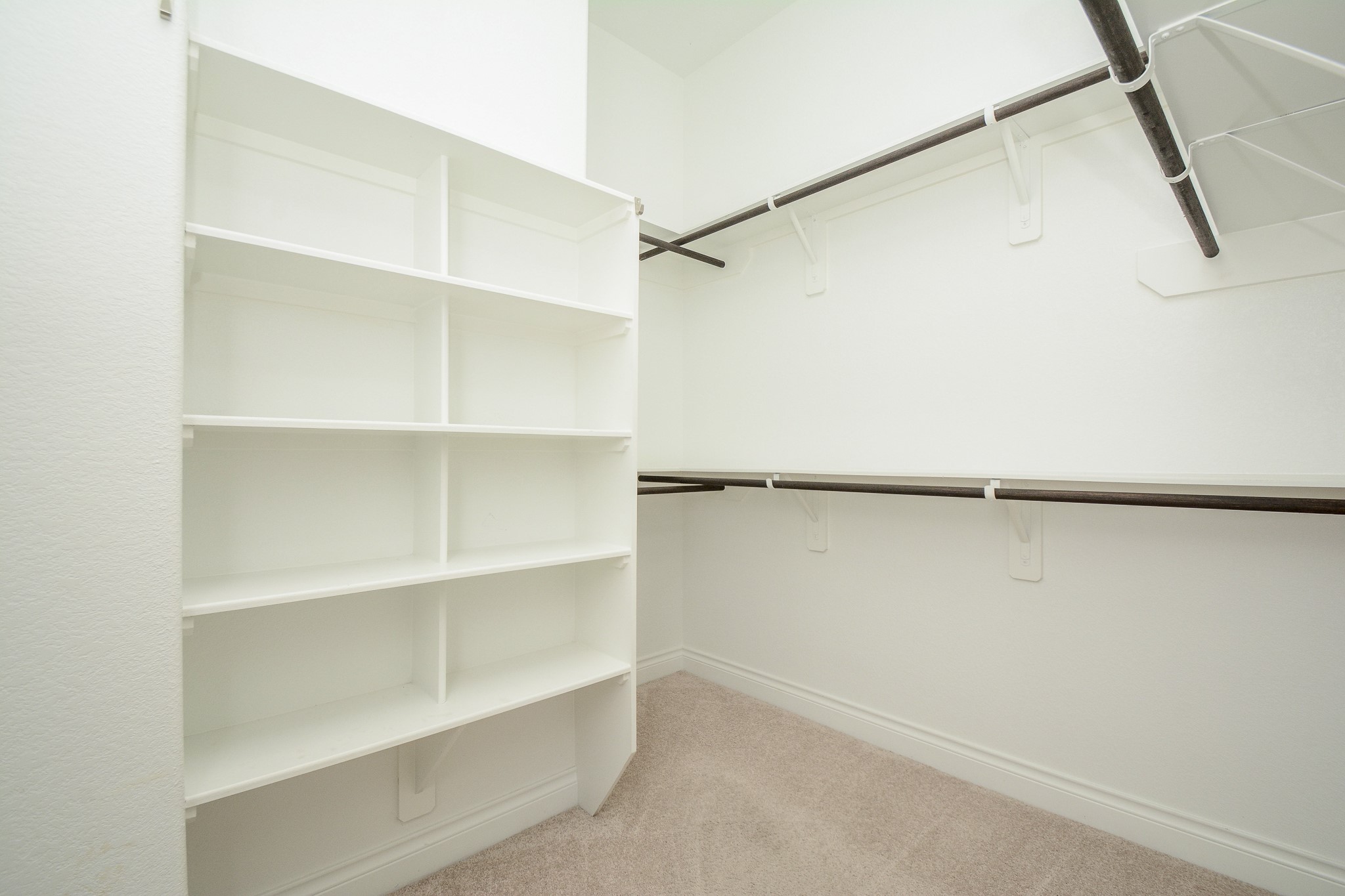 28127 Knight Peak Drive Spring, TX 77386 - Photo 27 of 42 a view of walk in closet with empty racks