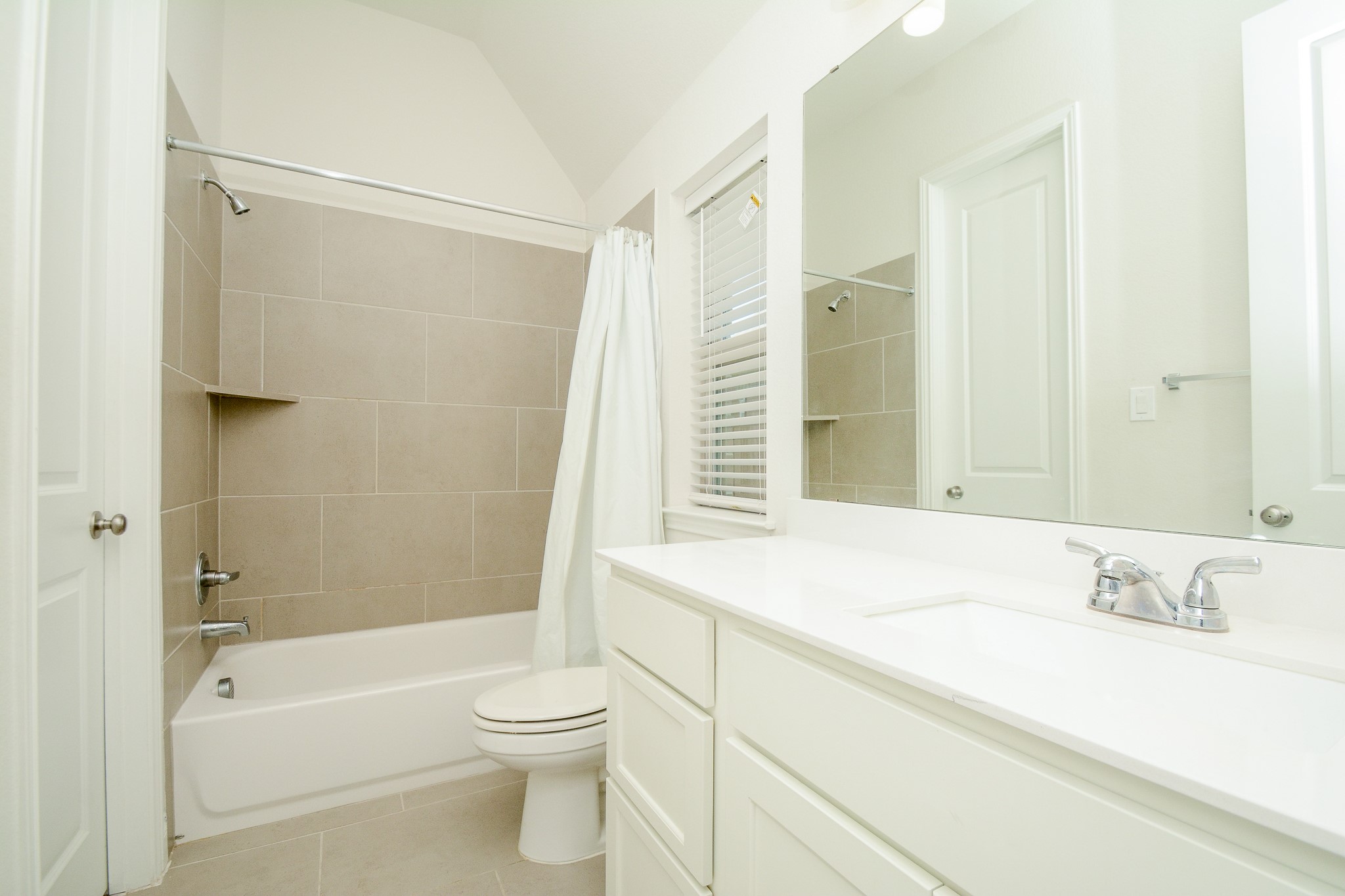 28127 Knight Peak Drive Spring, TX 77386 - Photo 31 of 42 a bathroom with a granite countertop sink a toilet and shower
