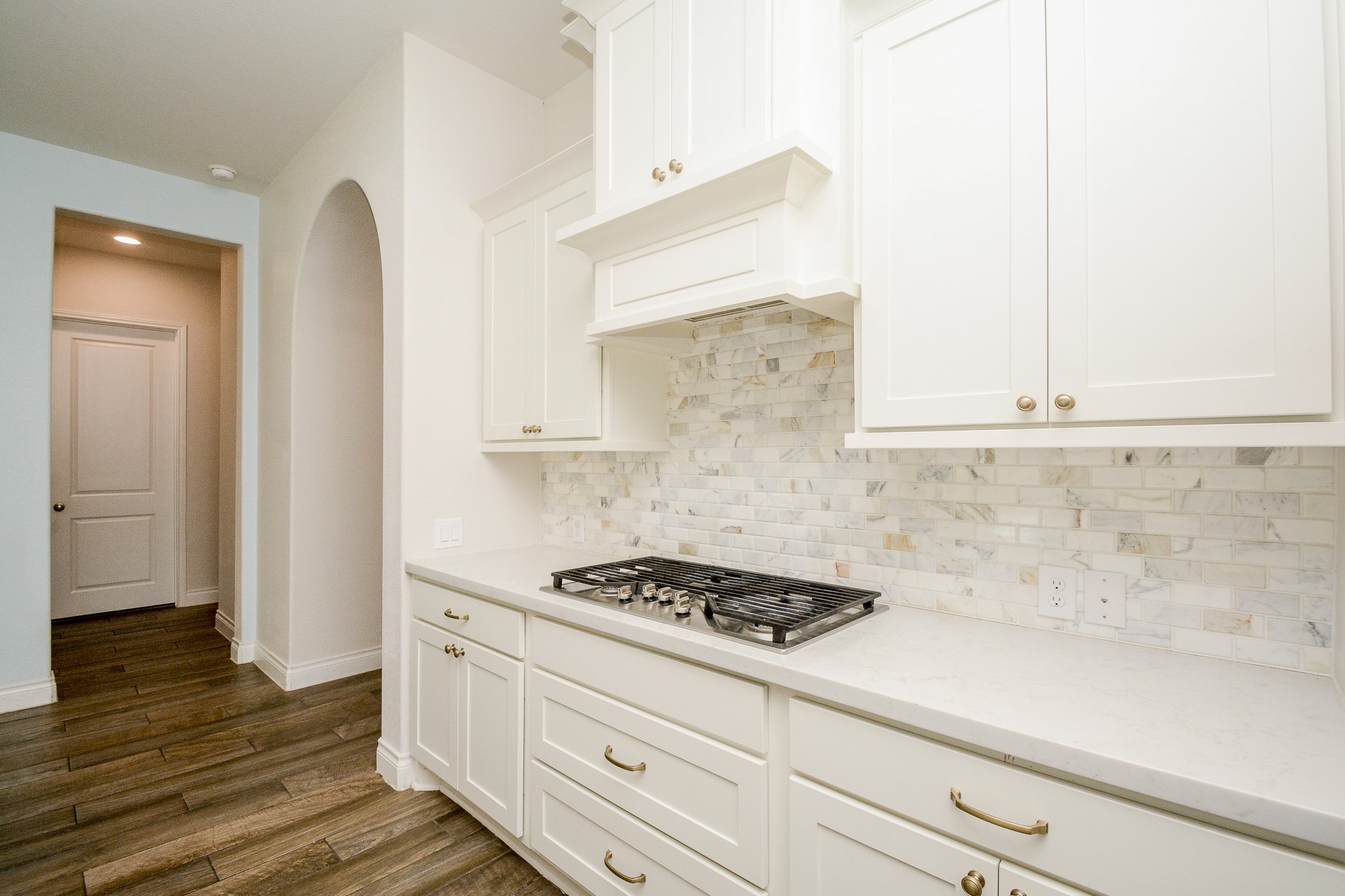 28127 Knight Peak Drive Spring, TX 77386 - Photo 10 of 42 a kitchen with granite countertop white cabinets and white appliances