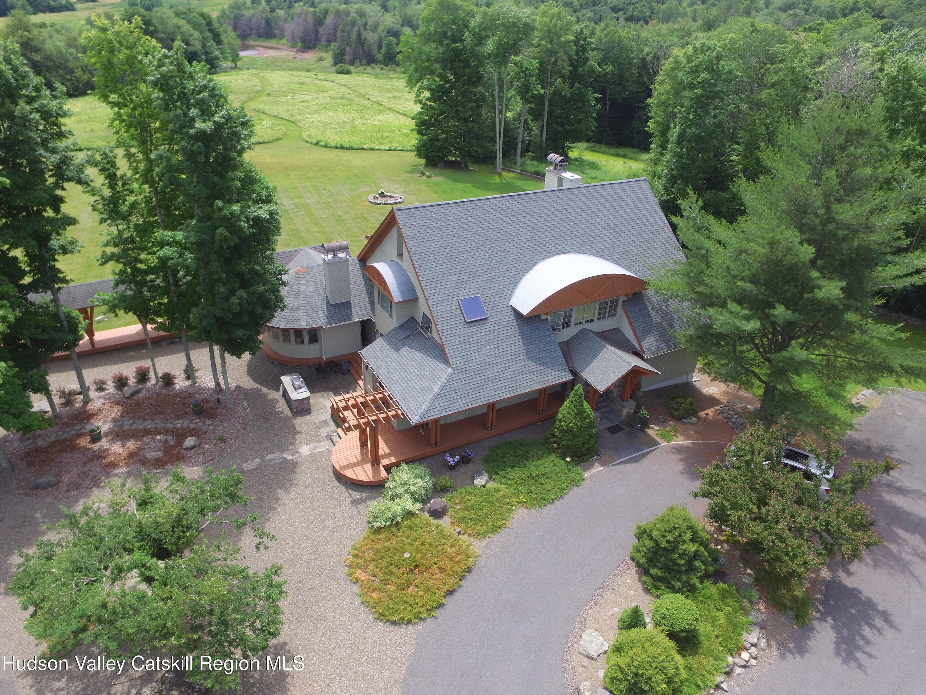 an aerial view of a house with outdoor space and street view