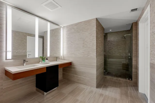 a spacious bedroom with a bed and a window