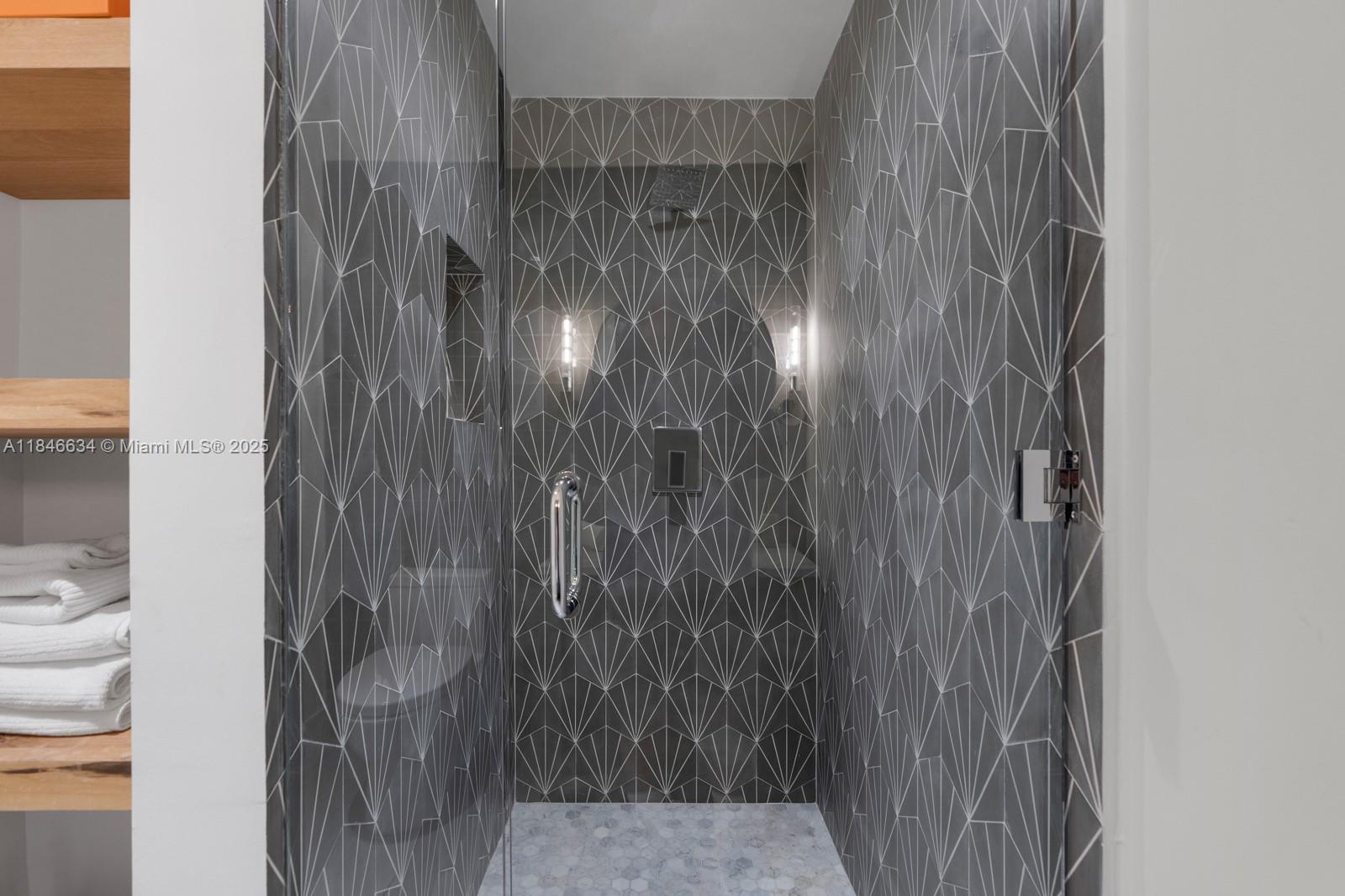 1 Collins Avenue, Unit 605 Miami Beach, FL 33139 - Photo 19 of 33 a bathroom with a shower