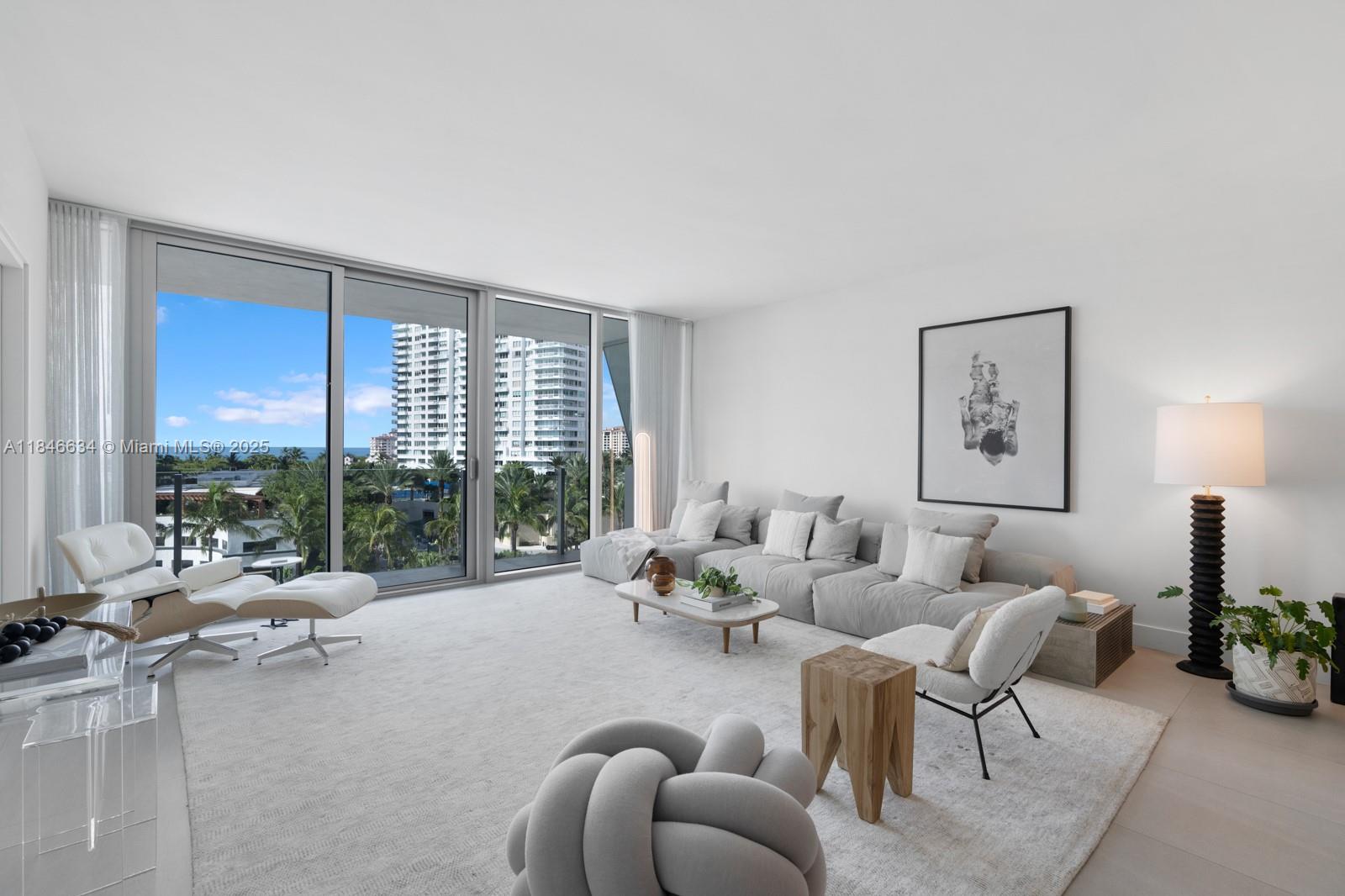 1 Collins Avenue, Unit 605 Miami Beach, FL 33139 - Photo 24 of 33 a living room with furniture and a large window