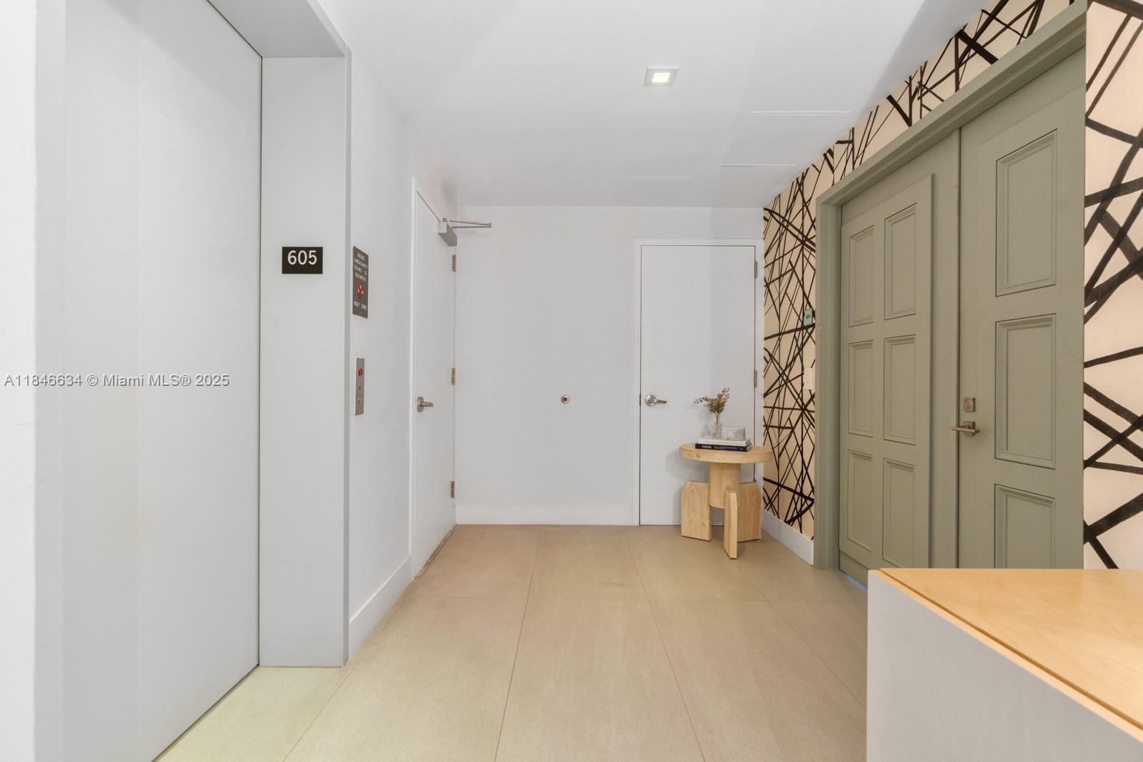 1 Collins Avenue, Unit 605 Miami Beach, FL 33139 - Photo 26 of 33 a view of a room with a sink and dishwasher