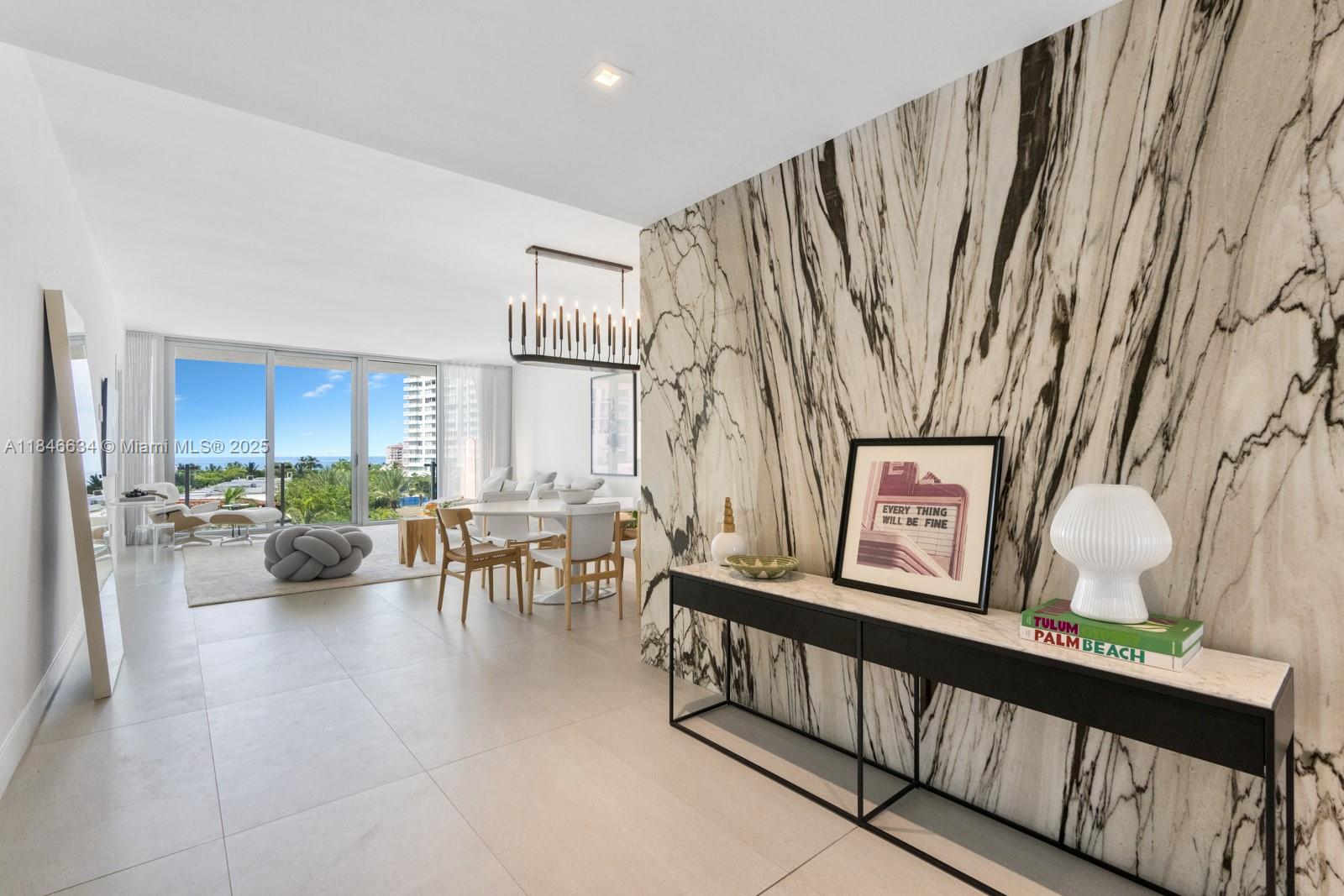 1 Collins Avenue, Unit 605 Miami Beach, FL 33139 - Photo 9 of 33 a view of living room with furniture and a large window