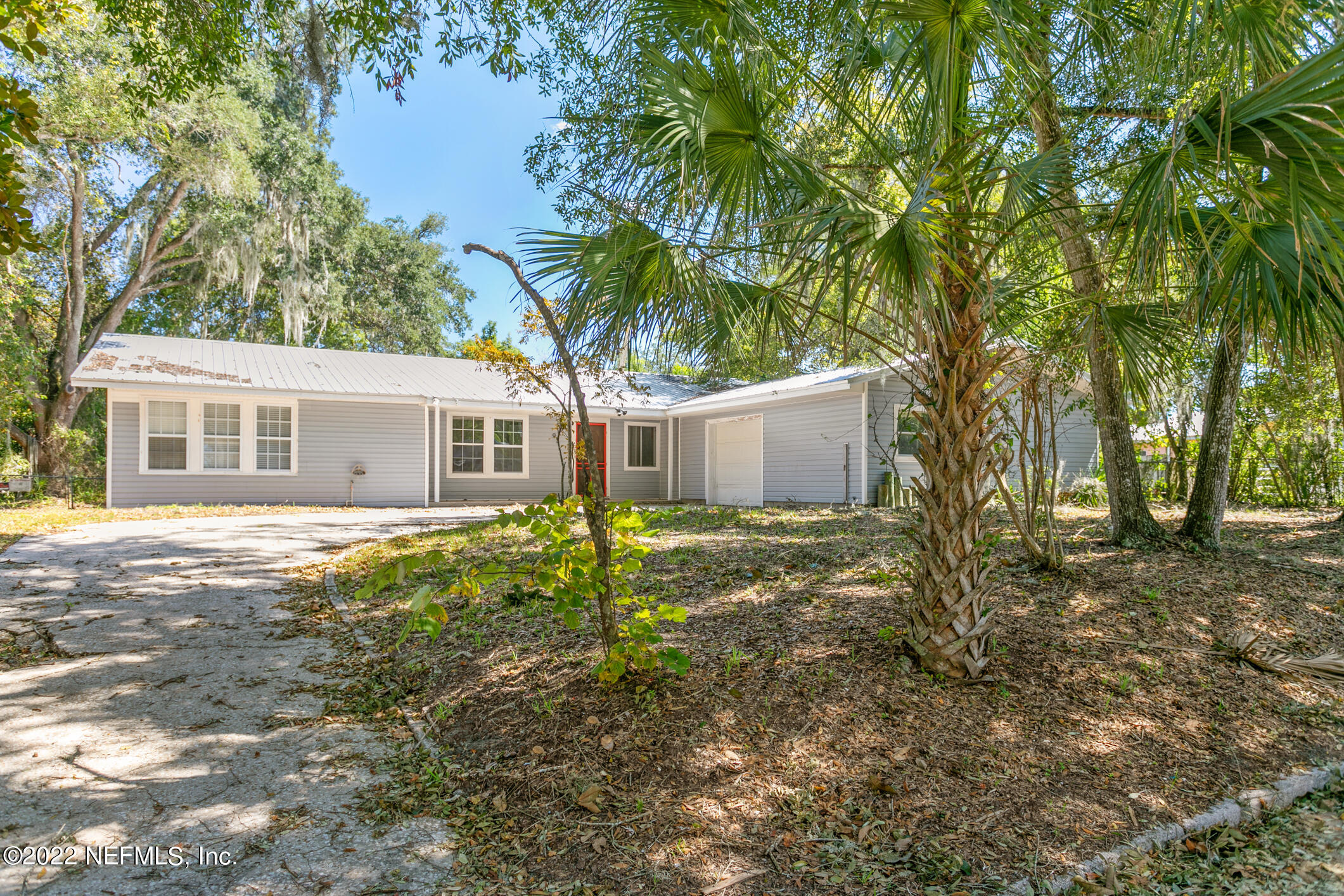 97 Spring Street St. Augustine, FL 32084 - Photo 1 of 18 a view of a house with a yard