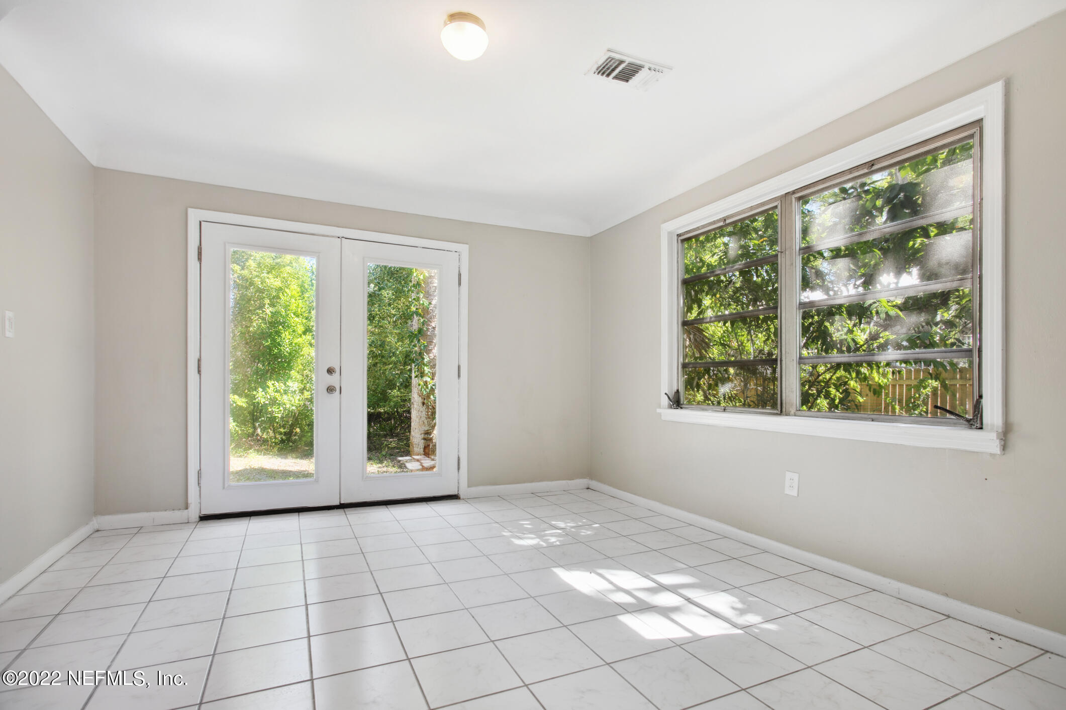 97 Spring Street St. Augustine, FL 32084 - Photo 11 of 18 a view of an empty room with a window