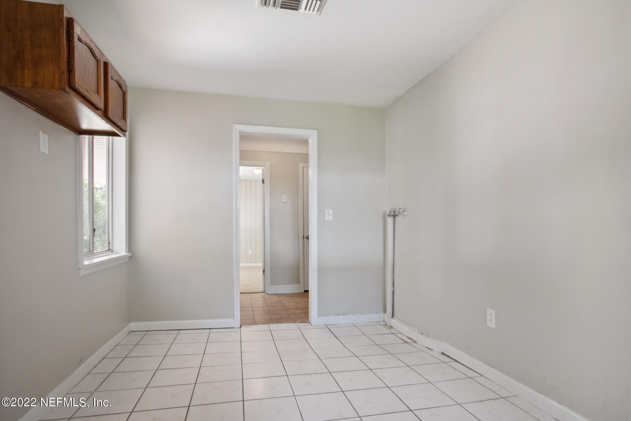 97 Spring Street St. Augustine, FL 32084 - Photo 16 of 18 a view of an empty room and window