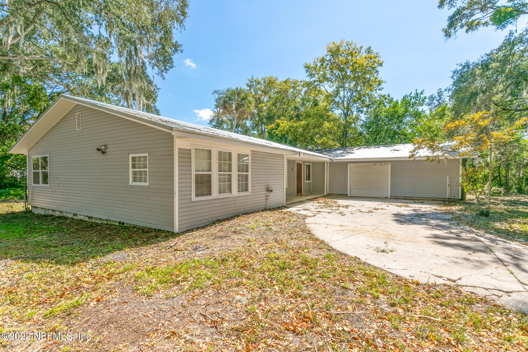 97 Spring Street St. Augustine, FL 32084 - Photo 2 of 18 a view of a house with a yard