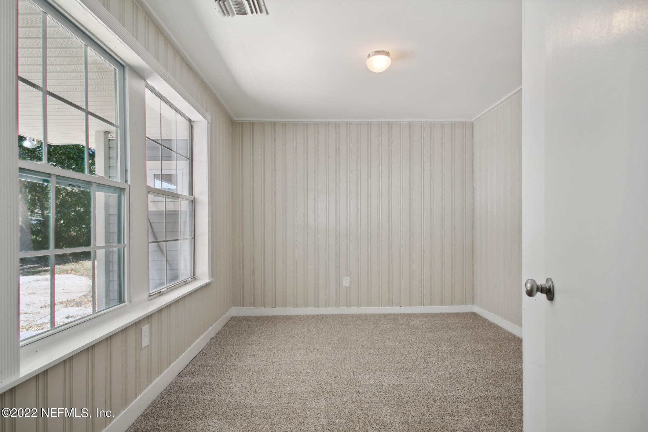97 Spring Street St. Augustine, FL 32084 - Photo 4 of 18 a view of an empty room with a window